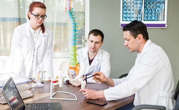 Patient Care - medics in team meeting 